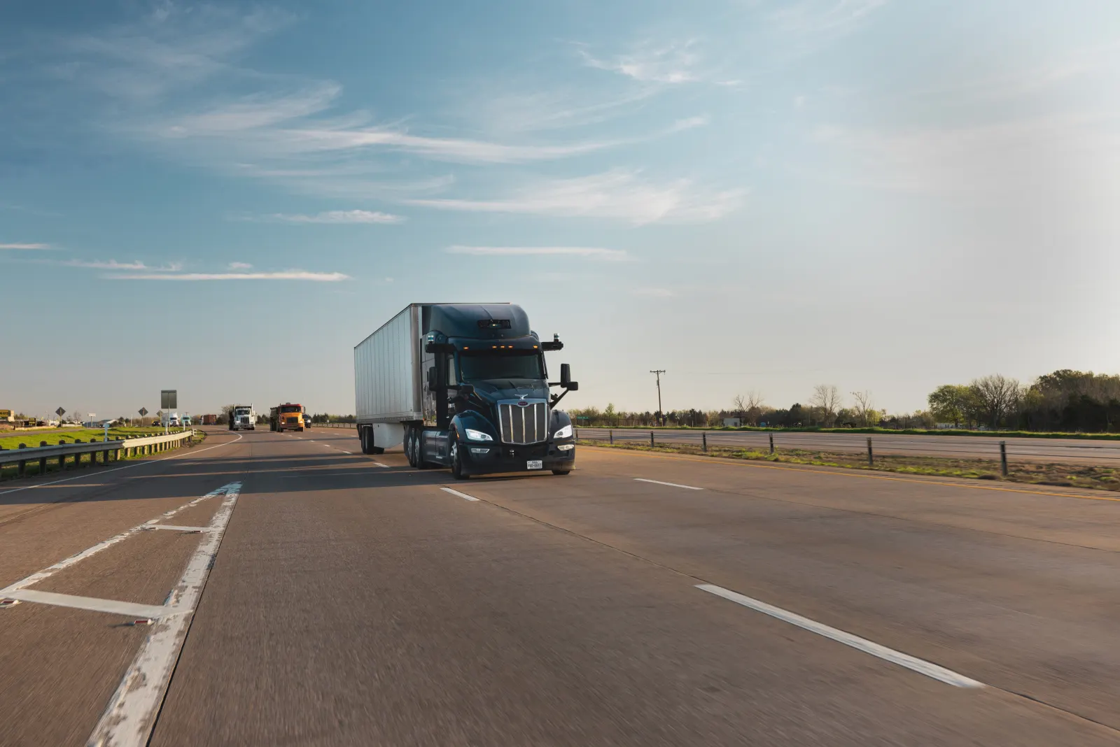 An Aurora Driver-powered Class 8 truck on a US highway — photo: Aurora Innovation (company press image)