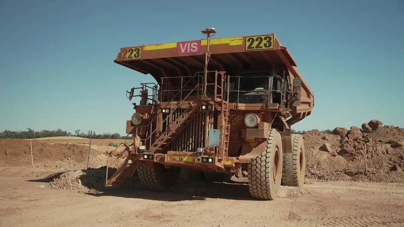 A haul truck fitted with Hexagon’s Vehicle Intervention System on an open-pit haul road. Image: Hexagon (press image, 3 September 2026)