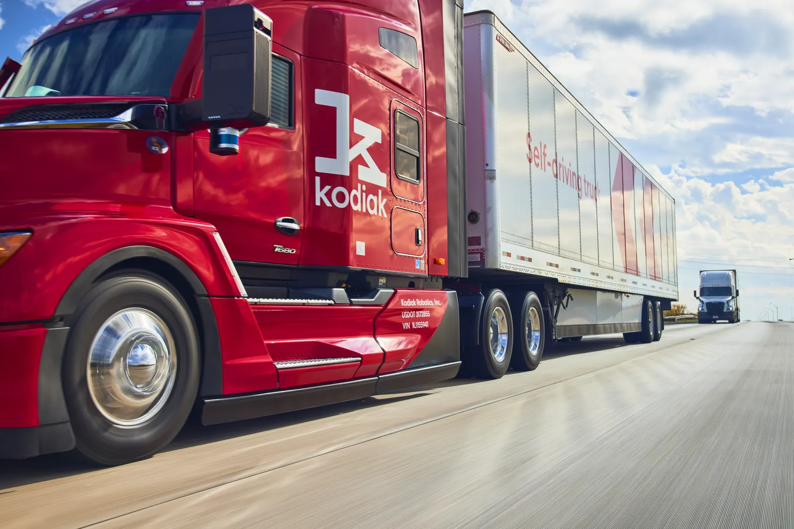 A Kodiak Driver-equipped tractor with roof-mounted SensorPods on the highway — supplied in Kodiak’s media kit as fifth-generation hardware, not the seventh-generation platform described here. Photo: Kodiak AI