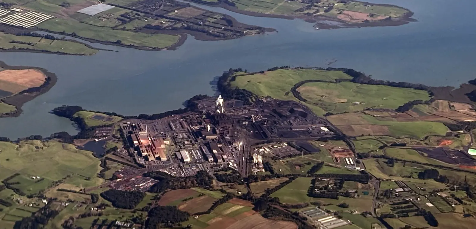 The Glenbrook steelworks on the Waiuku estuary, south of Auckland, May 2026 — photo: Wikimedia Commons user Paora, CC0